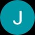 White capital letter J centered in a solid teal circle on a black background.